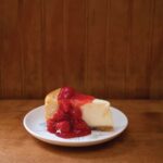 Cherry-Cheesecase-on-a-white-plate