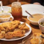 fried-chicken-in-the-middle-of-a-full-dining-table