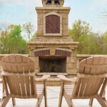 Front-view-of-fireplace-peeking-through-the-backs-of-two-adirondack-chairs