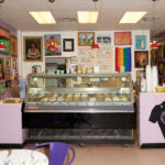 Front-view-of-the-ice-cream-display-counter-in-Sparkys-framed-art-all-along-every-walls