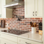 interior-kitchen-stove-top-pot-filler-on-brick-wall