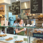 Amanda-Rainey-behind-the-counter-at--Goldies-Bagels