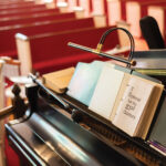 Piano-with-hymnal-on-stand