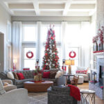 Wide-show-of-living-room-with-red-and-silver-tree-in-front-of-windows