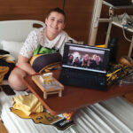 Kiddo-in-hospital-bed-with-computer-on-a-zoom-call-with-playing-4-hope-volunteers