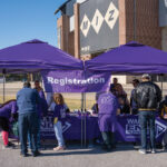 Registration-booths-with-purple-canopies-in-front-of-the-Mizzou-arena