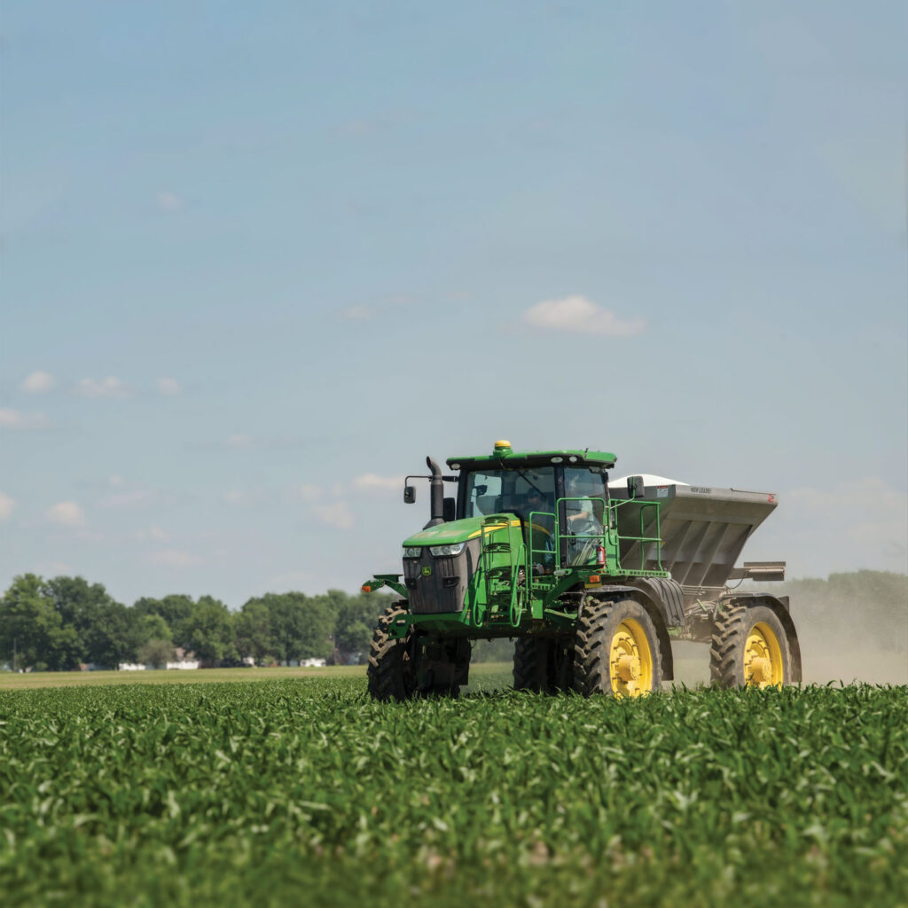 An MFA custom applicator spreads fertilizer on a field of corn.