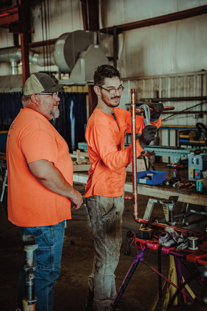 A 3rd Year Apprentice Works With Prefab Foreman Jason Wake.