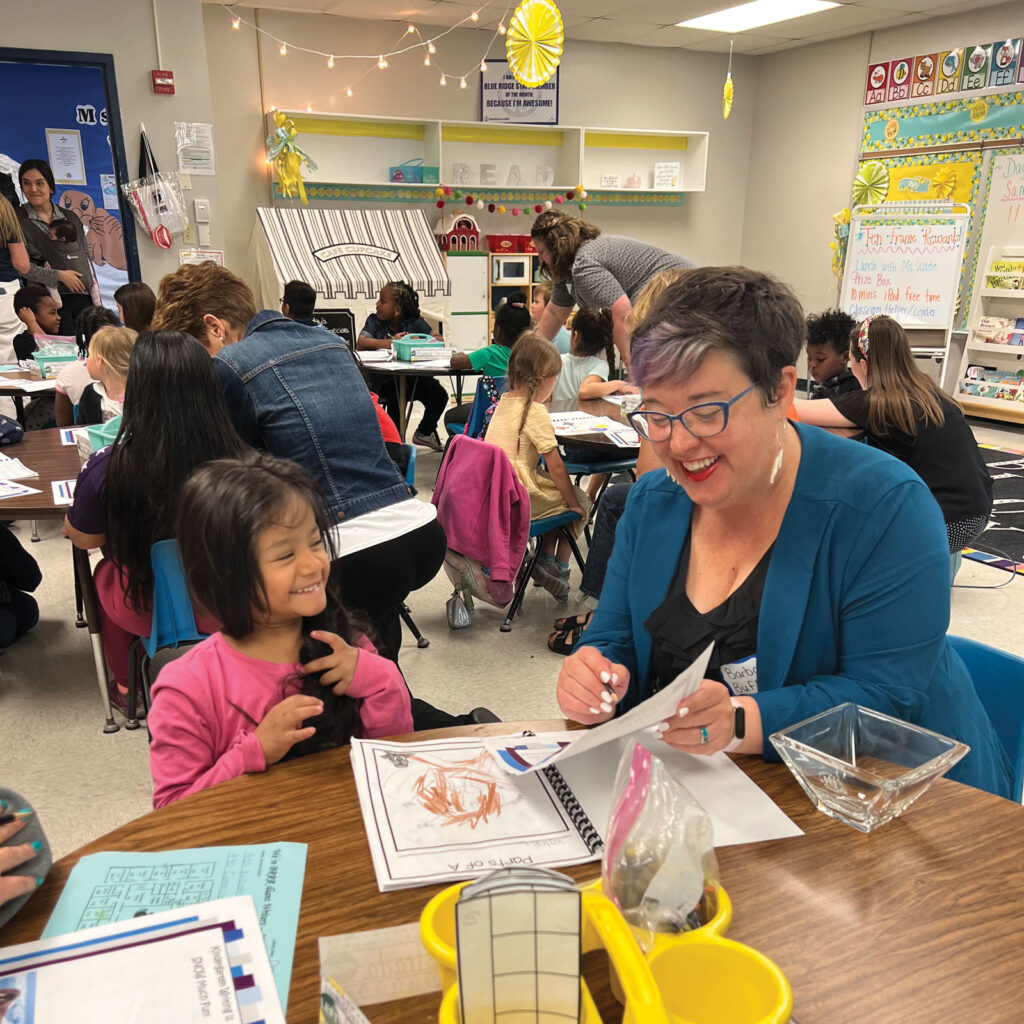 Mayor Barbara Buffaloe with a smiling student in a classroom