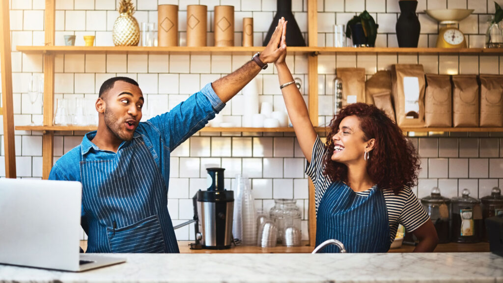Small Business Owners High Fiving