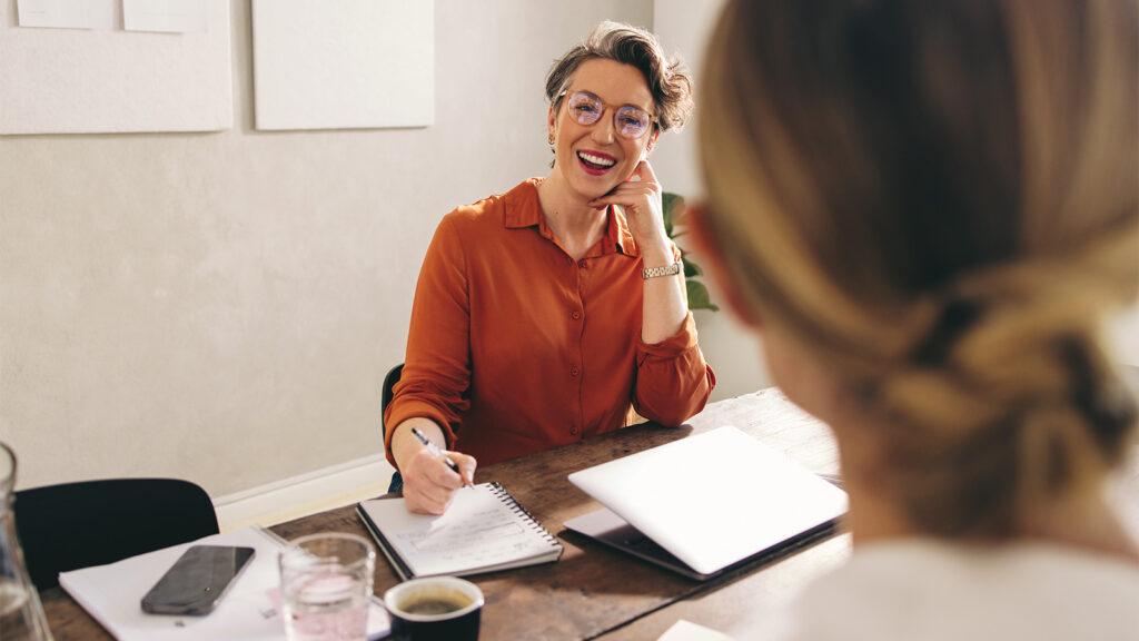 Coworkers engaged in conversation creating a supporting environment