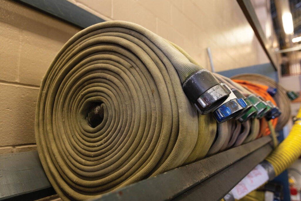 Columbia Fire Department Hoses Rolled On Shelf