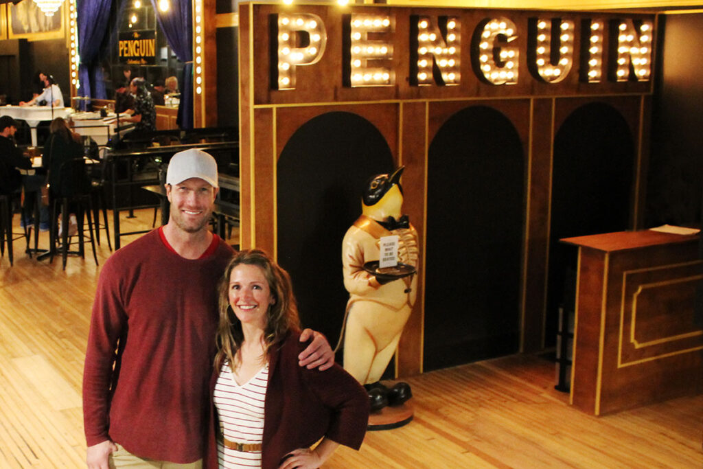 Gia and Rob Reade in front of the Penguin restaurant and piano bar in downtown Columbia, Missouri.