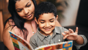 Woman Holding Young Child Reading