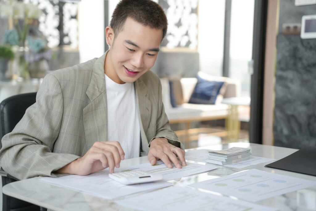 Asian business man checking statements.