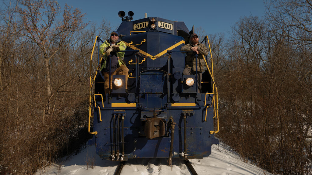 Featured Colt Railroad Operators Matthew Sabath And James Day Stand On The Train Exterior