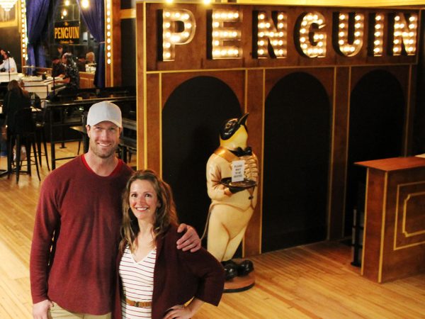Gia and Rob Reade in front of the Penguin restaurant and piano bar in downtown Columbia, Missouri.