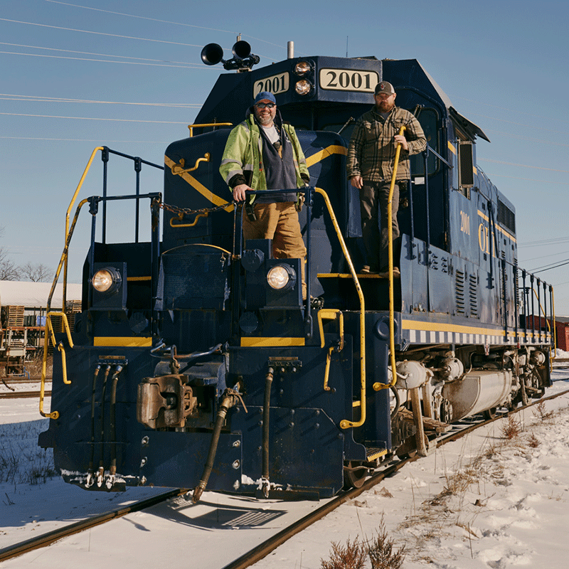 Railroad operators Matthew Sabath and James Day stop to take in the view.