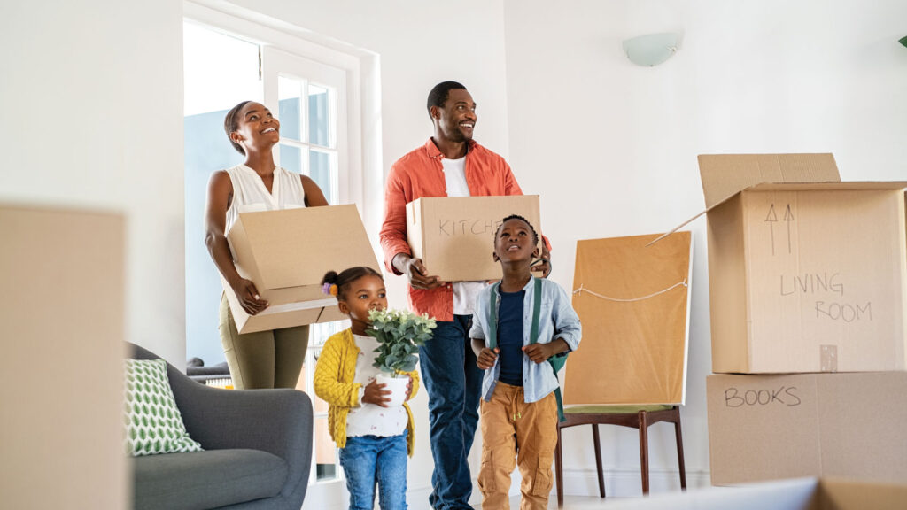 African American Family Moving Into Their New Home
