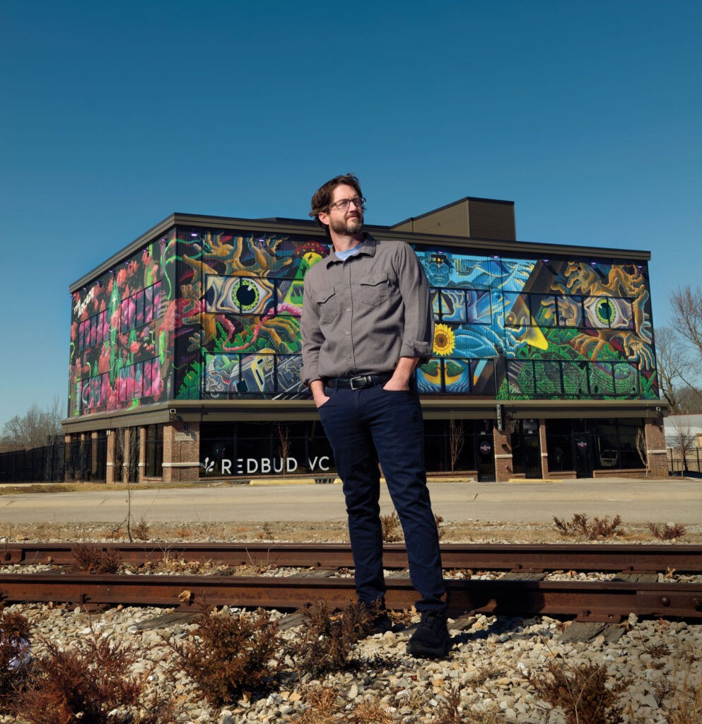 David Spear In Front Of Redbud Vc Building Mural In The Arcade District