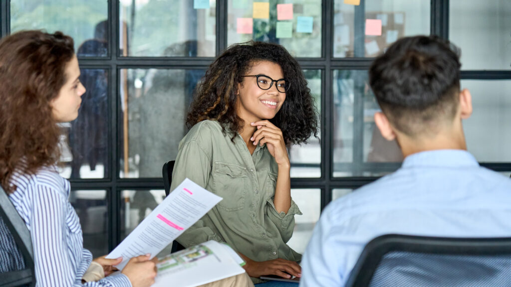 Featured Happy Employee In A Collaborative Workplace