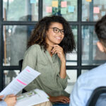 Featured Happy Employee In A Collaborative Workplace