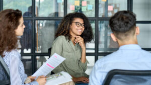 Featured Happy Employee In A Collaborative Workplace