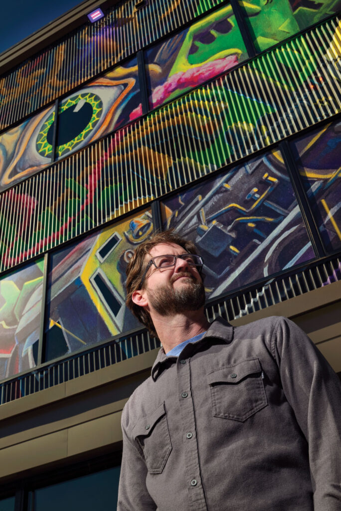 Portrait Of David Spear In Front Of Redbud Vc Building Mural