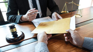 Featured Lawyer And Client Exchanging Title Insurance Papers