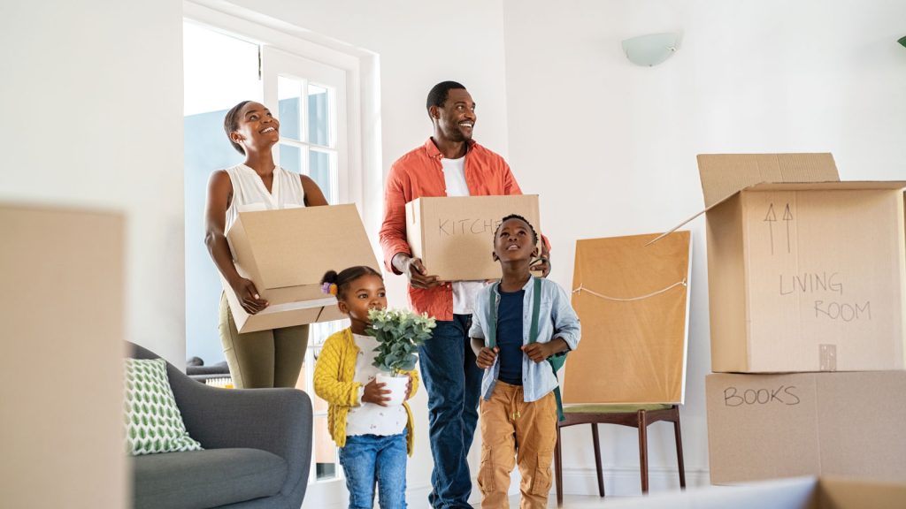 African American Family Moving Into Their New Home