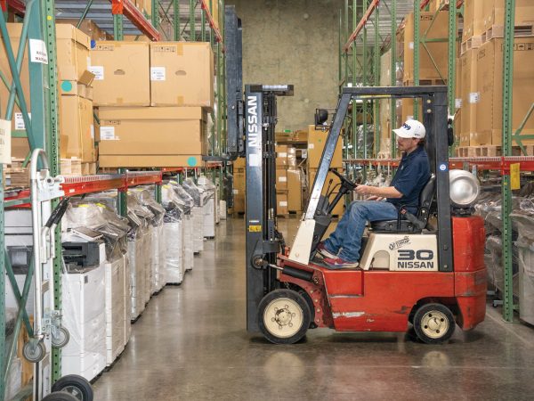 GFI warehouse in STL - red pallet truck approaching products
