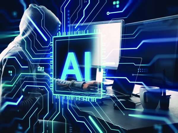 Hooded person at computer with digital AI interface overlay, futuristic cyber background, concept of cybercrime threats and artificial intelligence