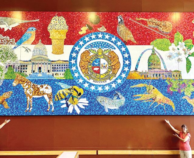 Artists-Aaron-Horrell-and-Barb-Bailey-showing-off-the-Missouri-Bicentennial-Mural