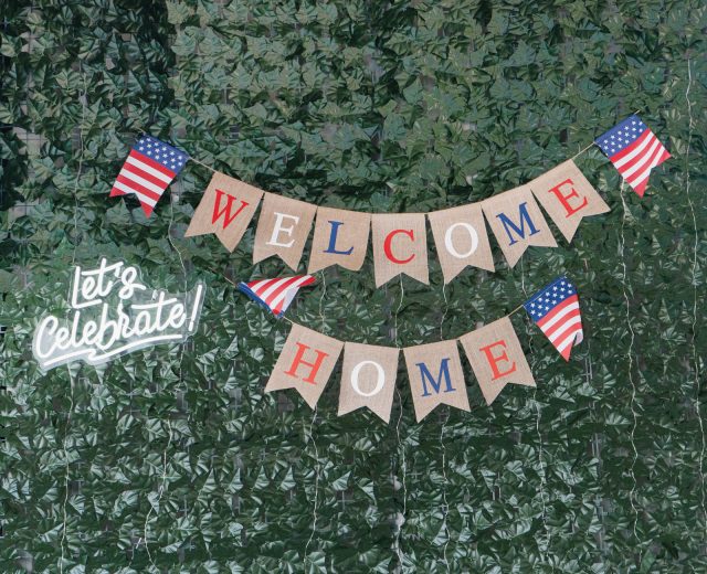 Ivy-Wall-with-Welcome-Home-Banner-and-neon-sign