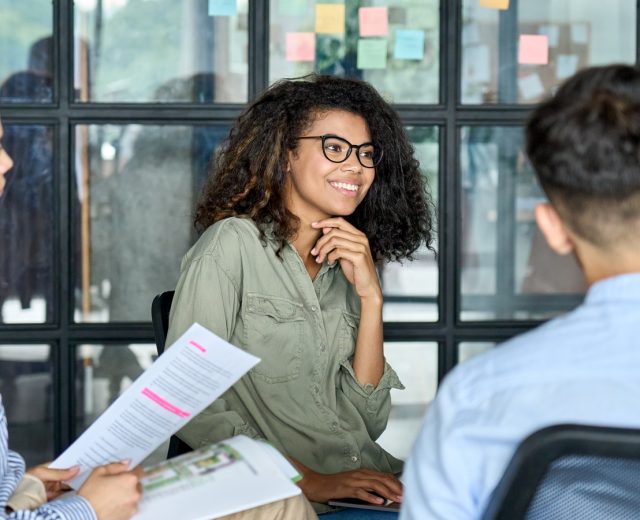 Featured Happy Employee In A Collaborative Workplace