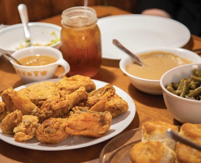 fried-chicken-in-the-middle-of-a-full-dining-table