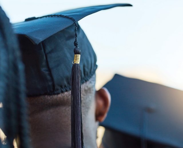 Student wearing a graduation cap at commencement